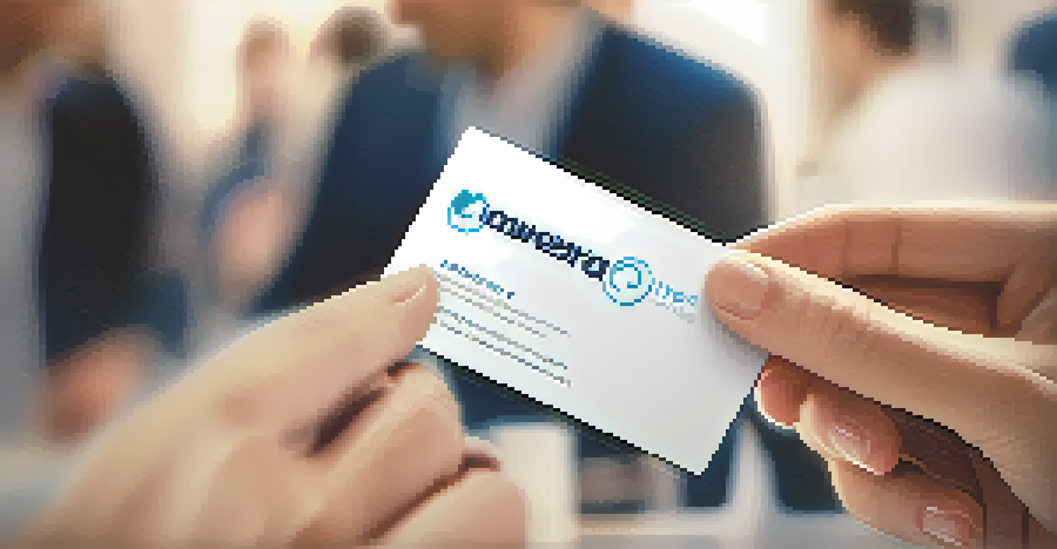 A close-up of a hand holding a stylish business card at a networking event with people blurred in the background.