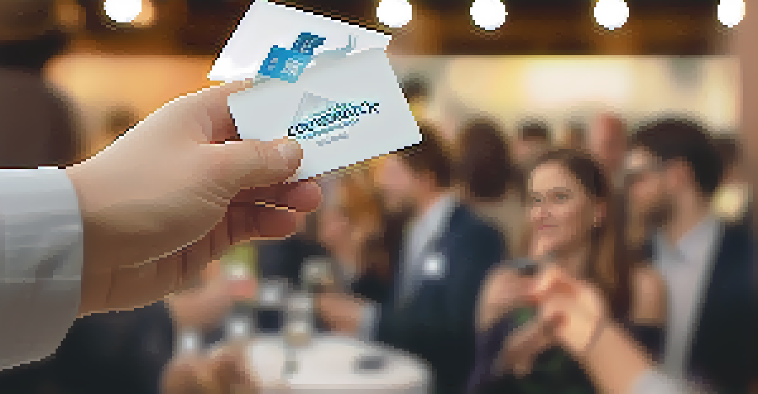 A close-up of a hand exchanging a business card at a networking event, with blurred figures in the background.