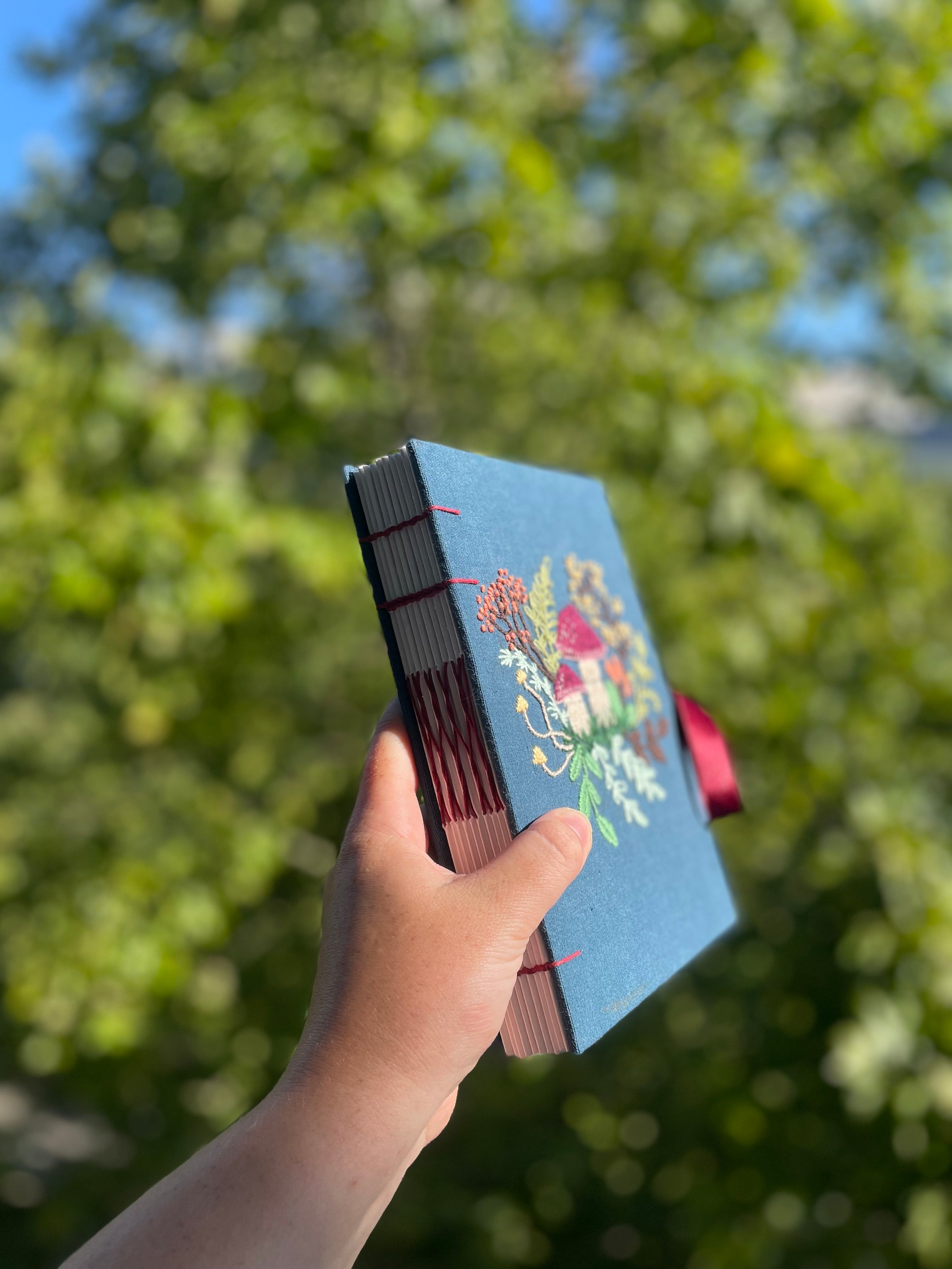 Hand holding notebook