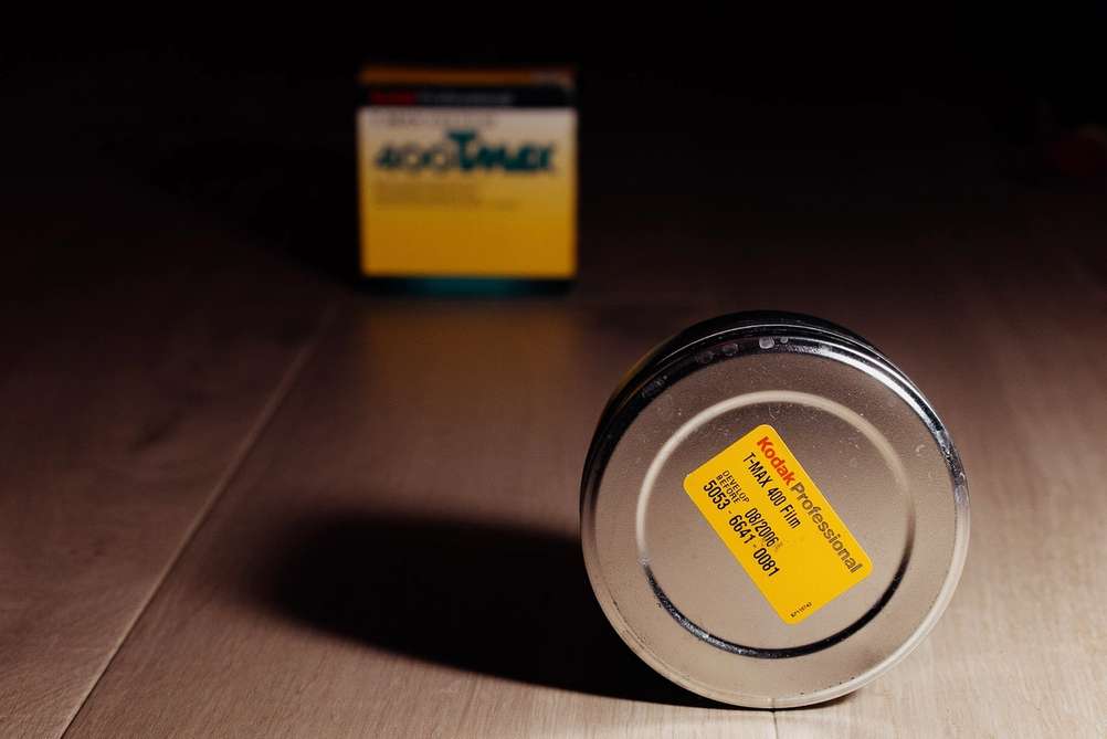 Photo of Kodak T-MAX 400 bulk roll tin container and packaging.