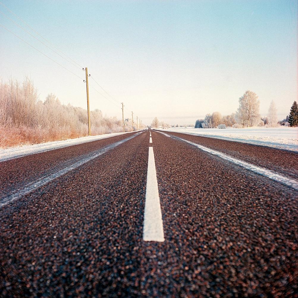 Photo of a wintery road.