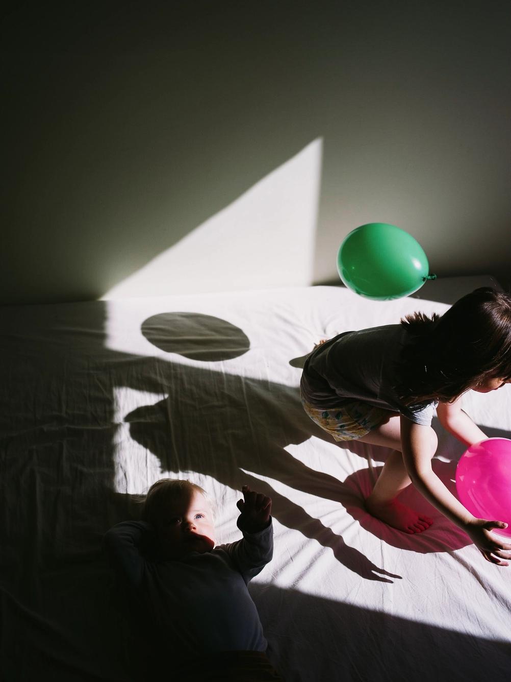 Photo of my children playing with baloons.