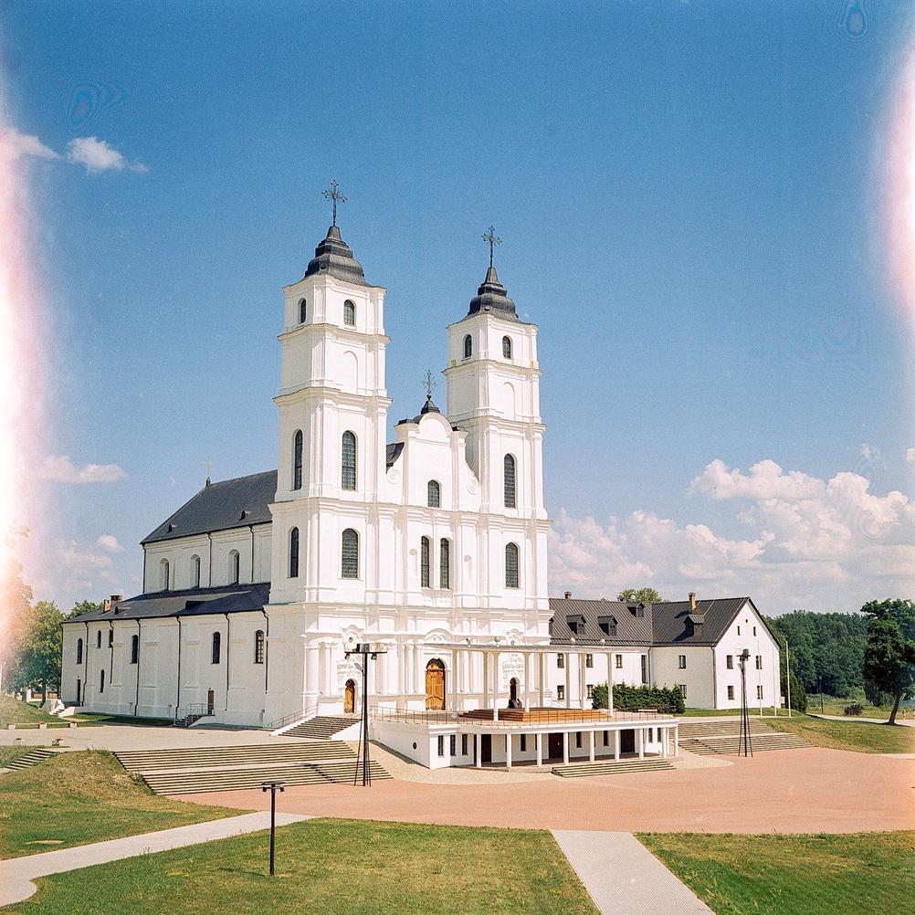 Photo of a big and white church.