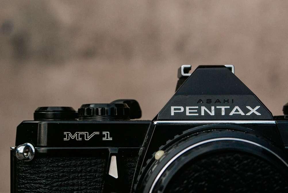 Pentax MV1 camera nameplate.