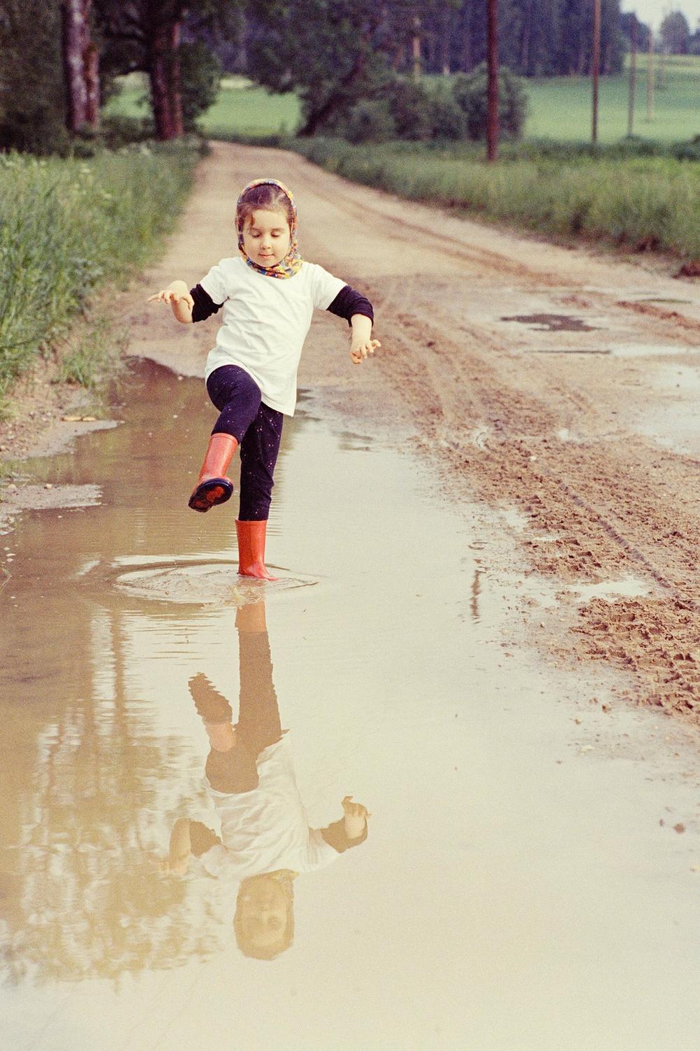 Photo of my daughter stomping a large puddle.