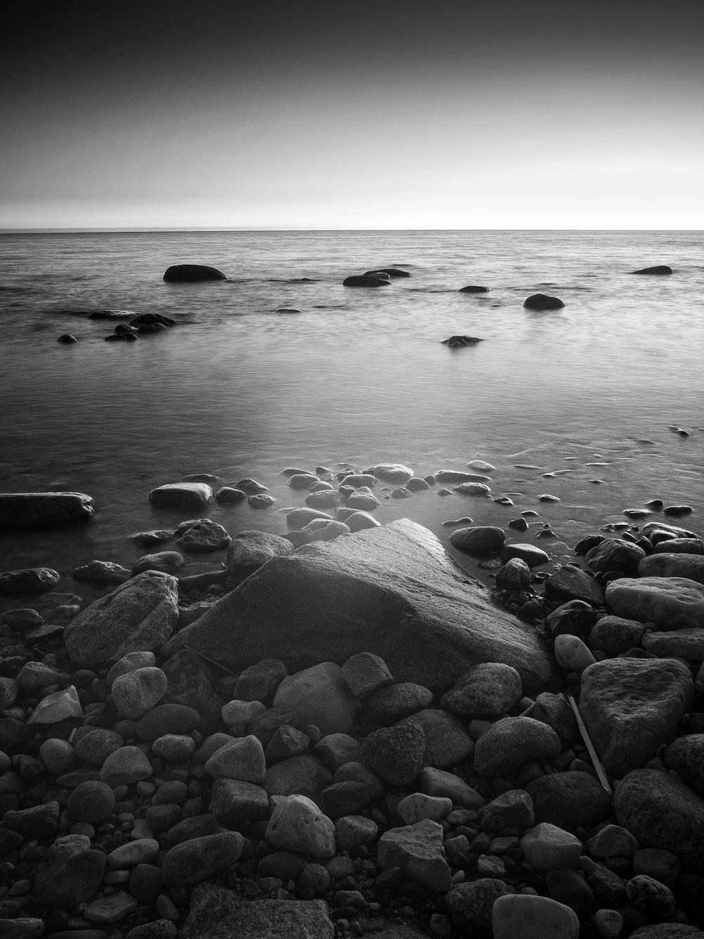 Photo of rocks on a beach taken with an infrared converted camera.
