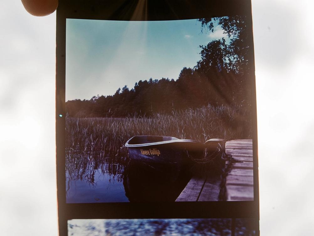Photo of Silberra Color 160 film strip with a positive on it.