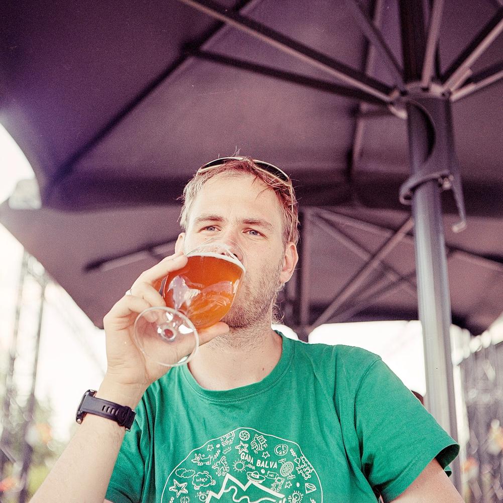 Photo of a man drinking beer.