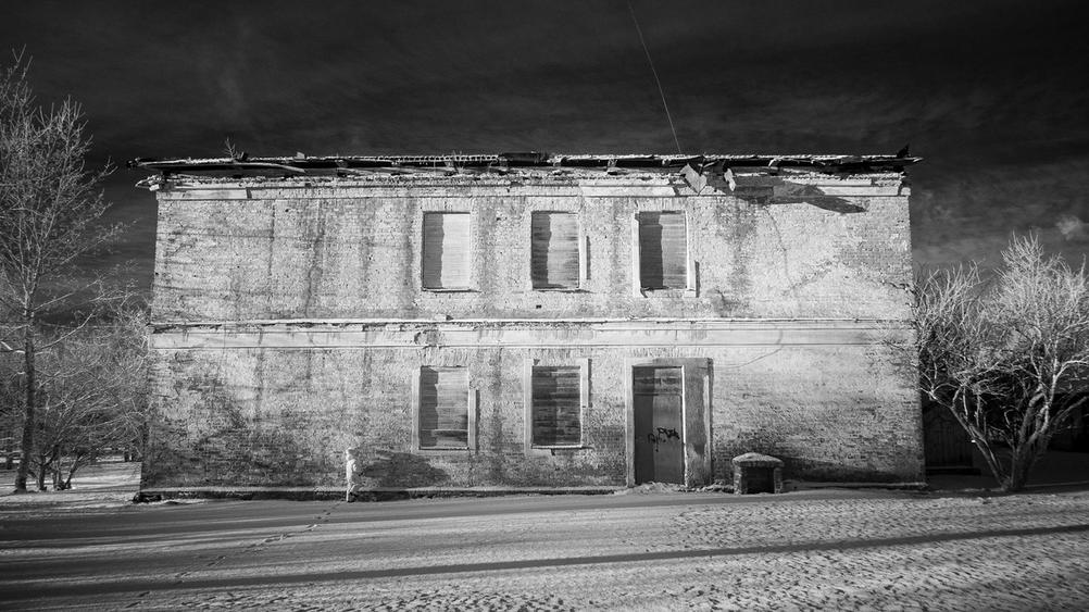 Photo of a run down building taken with infrared camera.