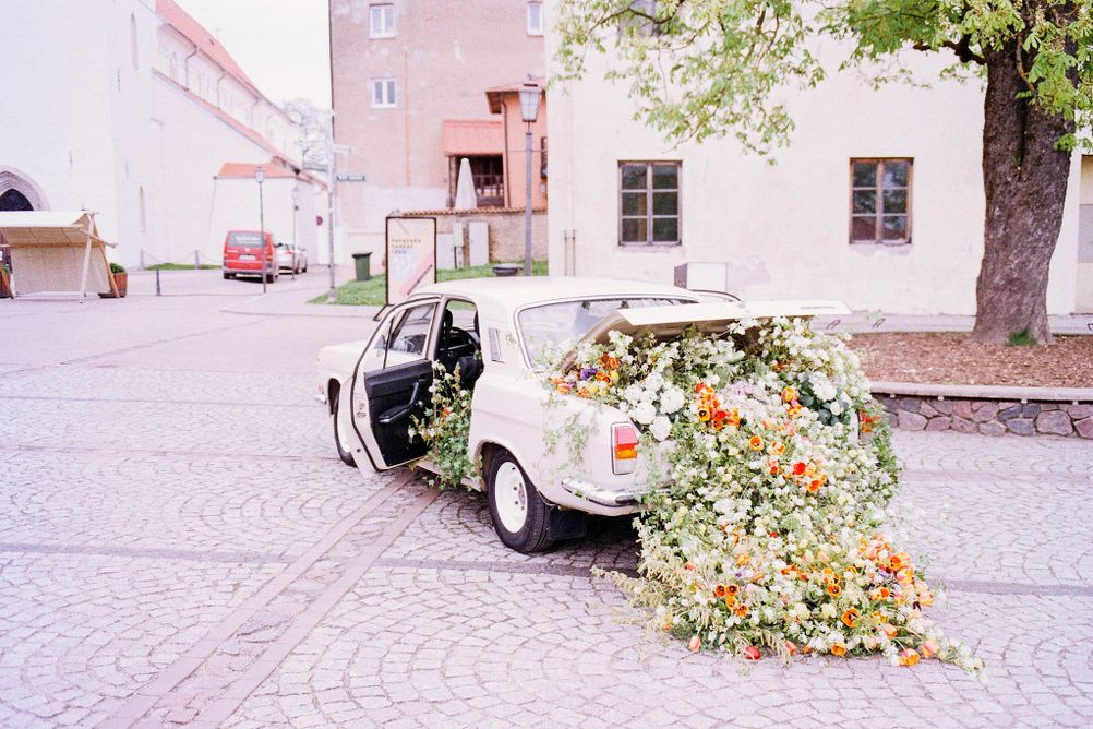 Photo of flowers exploding out of a car.