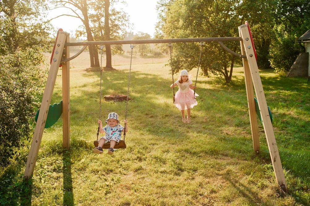 Photo of my children on swings.