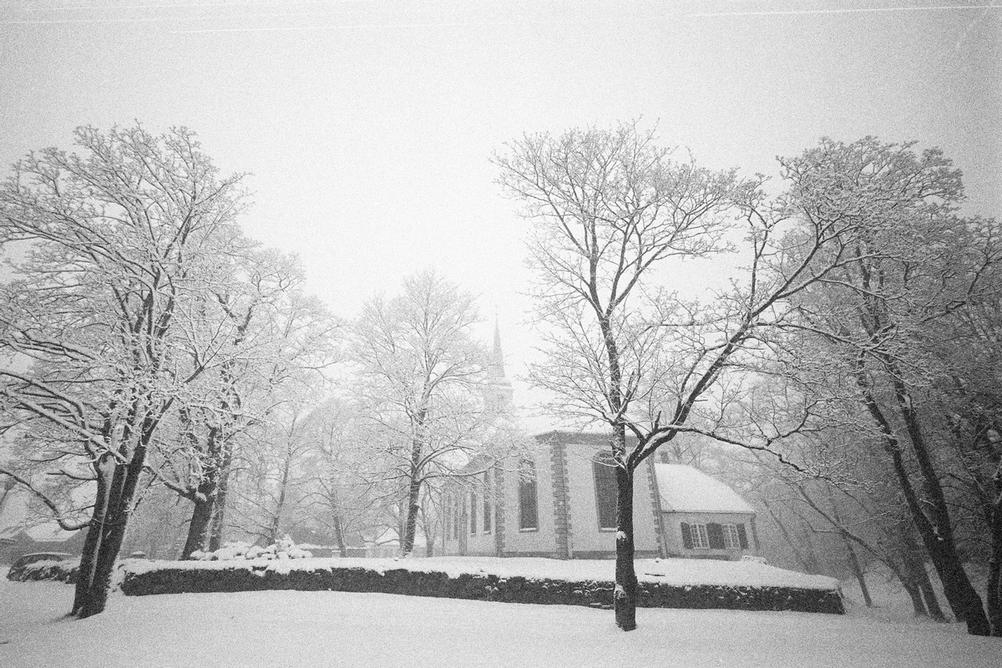 Photo of a church in wintery mist.