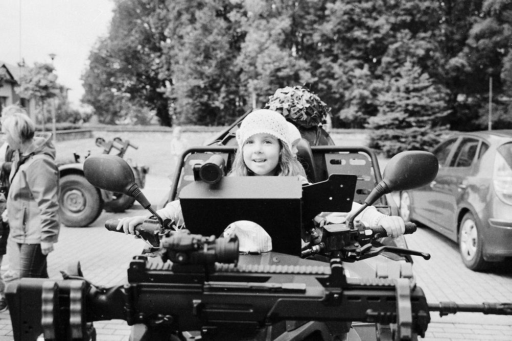 Photo of my daughter on a military vehicle.