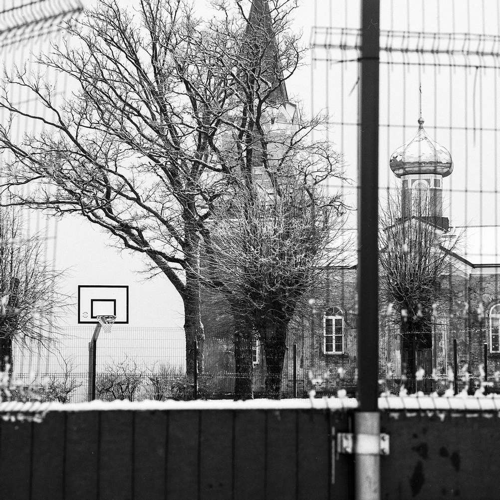 Photo of a basketball hoop and church.