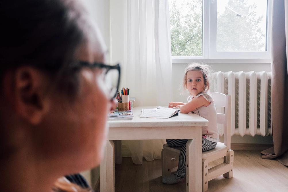 Photo of my wife looking at our daughter.