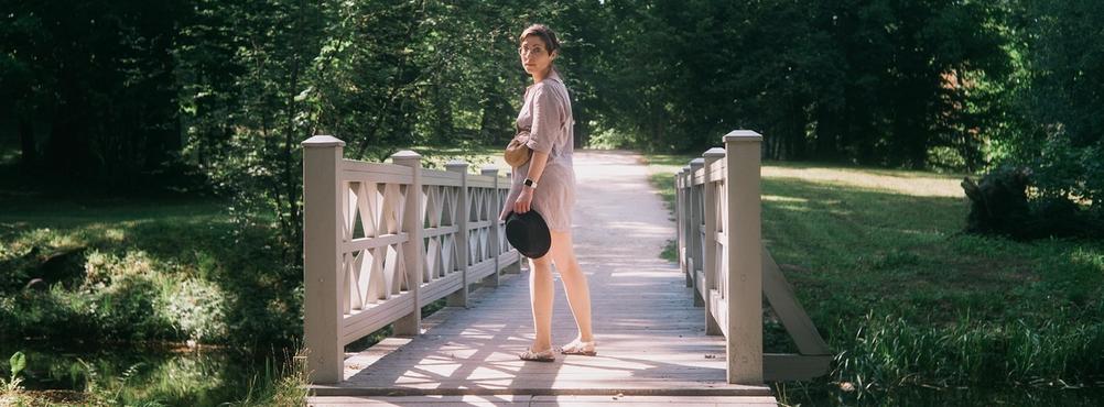 Photo of my wife about to cross a small bridge.