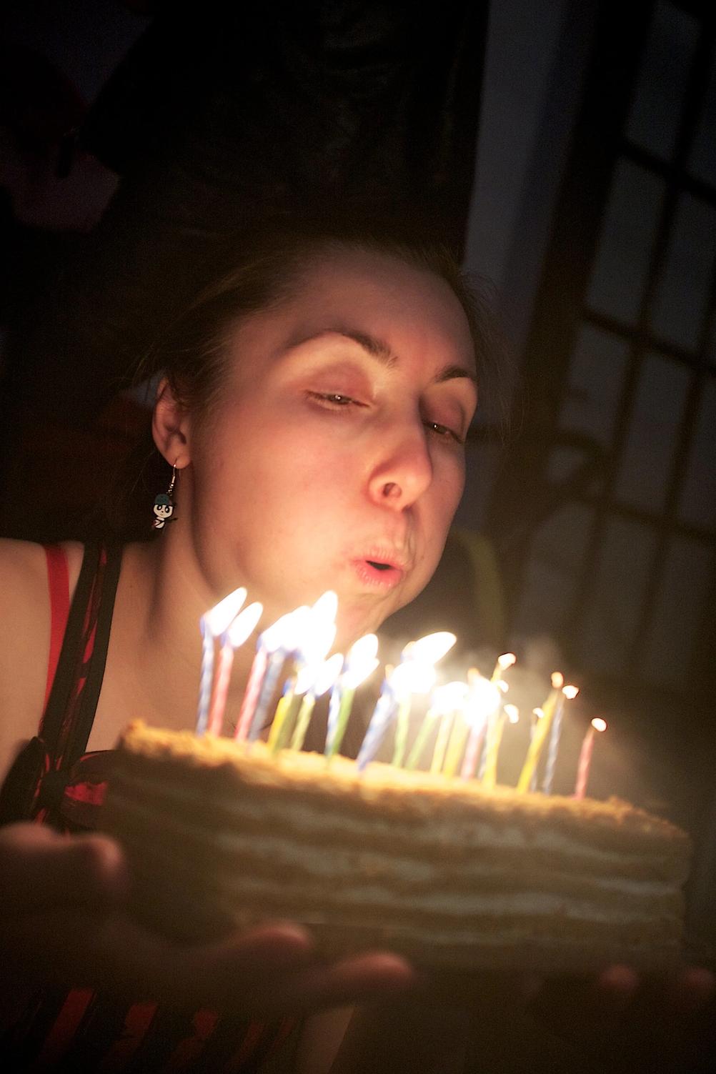 Photo of my wife blowing candles.