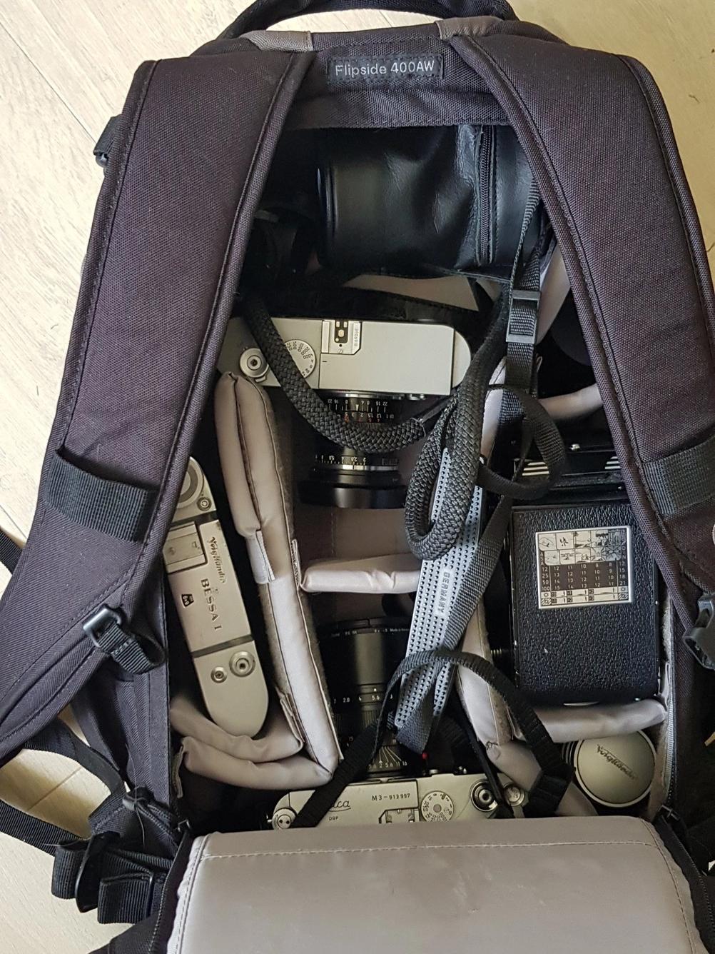 Photo of Lowepro Flipside 400AW bag full of photo related things.