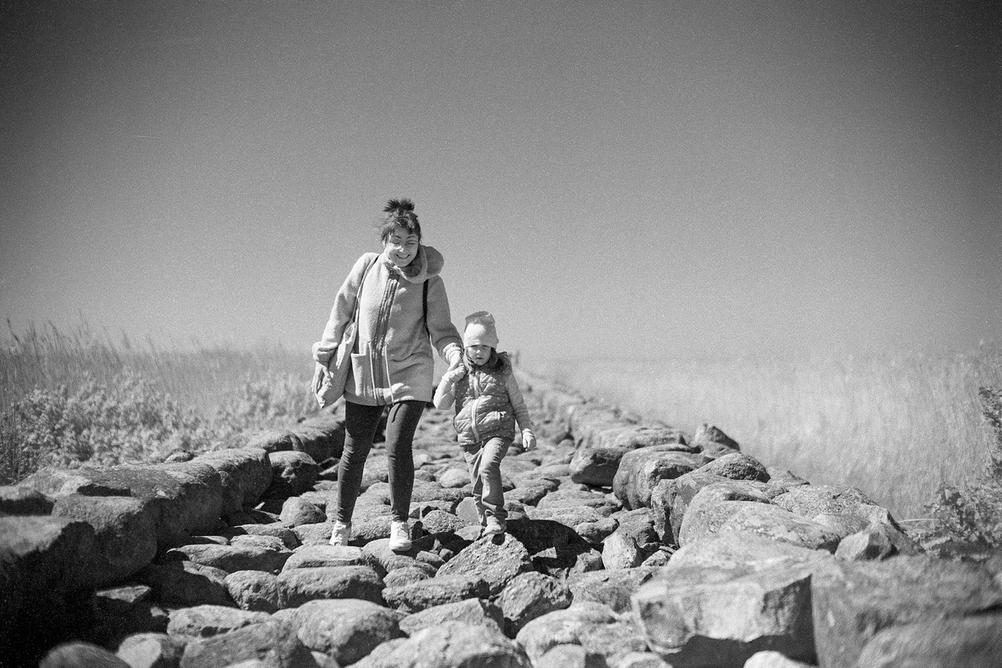 Photo of my wife and daughter walking on a very rocky road.