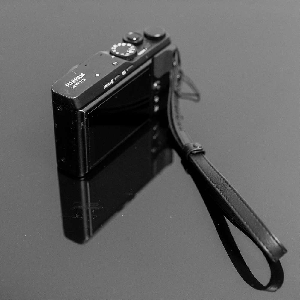 A photo of a well used Fujifilm XF10.