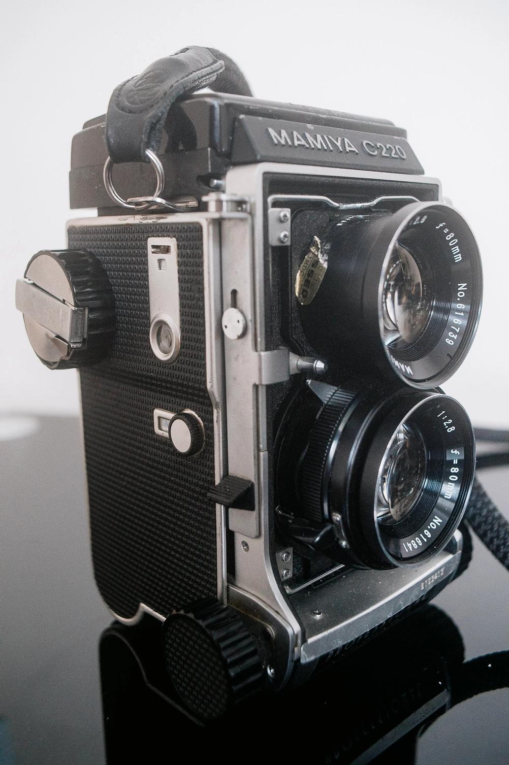 Mamiya C220 film advance knob and shutter release lever.