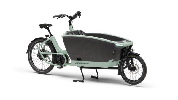 Urban Arrow FamilyNext Pro front-loader cargo e-bike in green, front three-quarter view