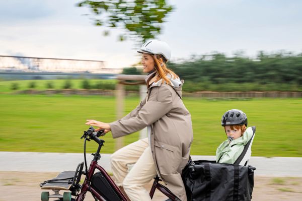 Parent riding a Tern Quick Haul with a child on the back