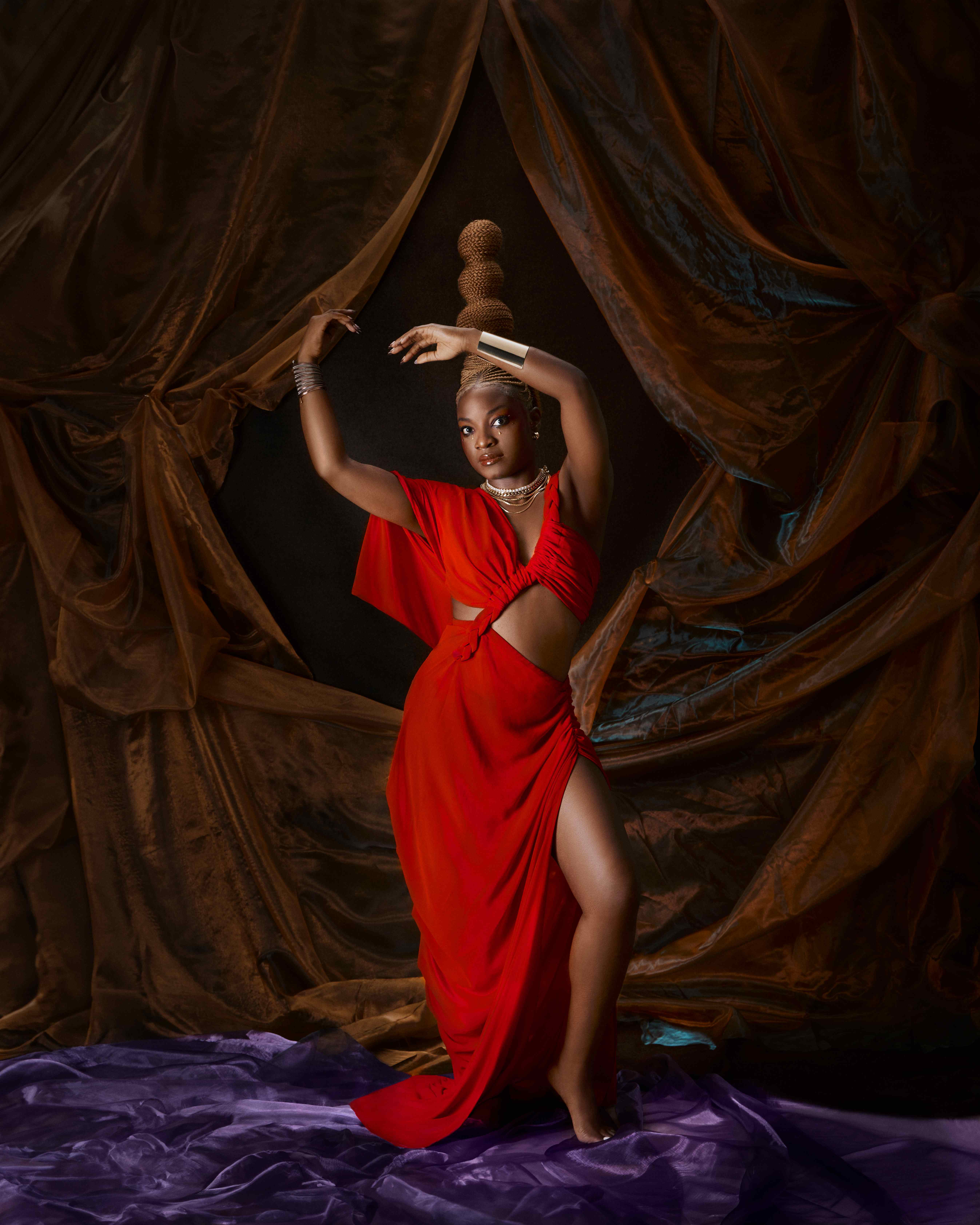 Sadé editorial - red dress with sculptural hair