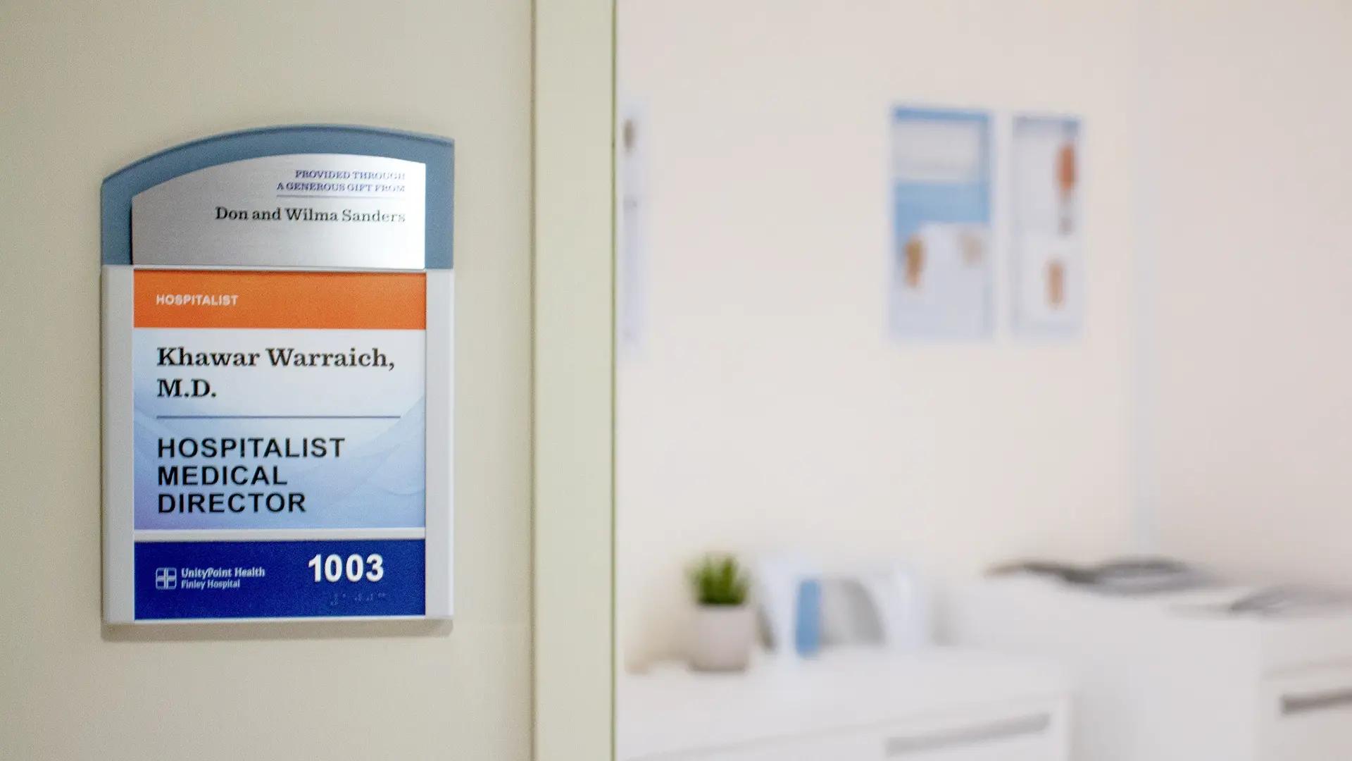 Hospital room recognition plaque honoring a named donor gift with clear room identification outside a patient room.