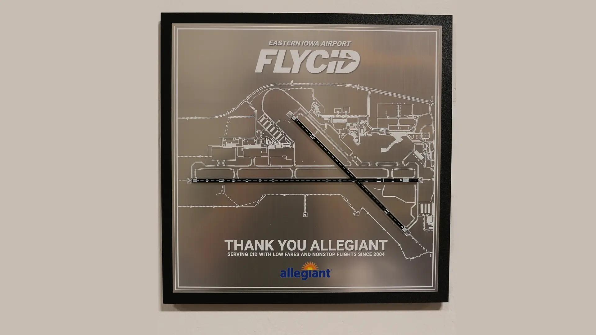 Bronze etched donor recognition plaque featuring the Eastern Iowa Airport layout, thanking Allegiant Air for service at CID.