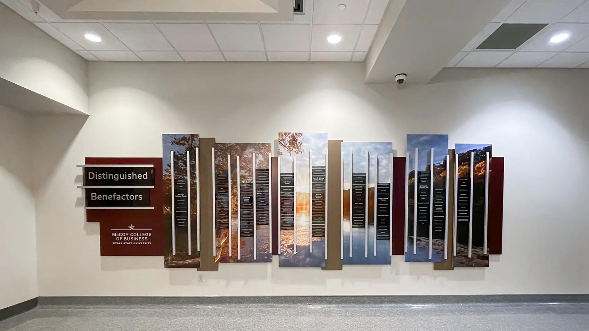 Distinguished Benefactors donor wall using exclusive Rail Wall with vertical name panels and scenic imagery at McCoy College in Texas.