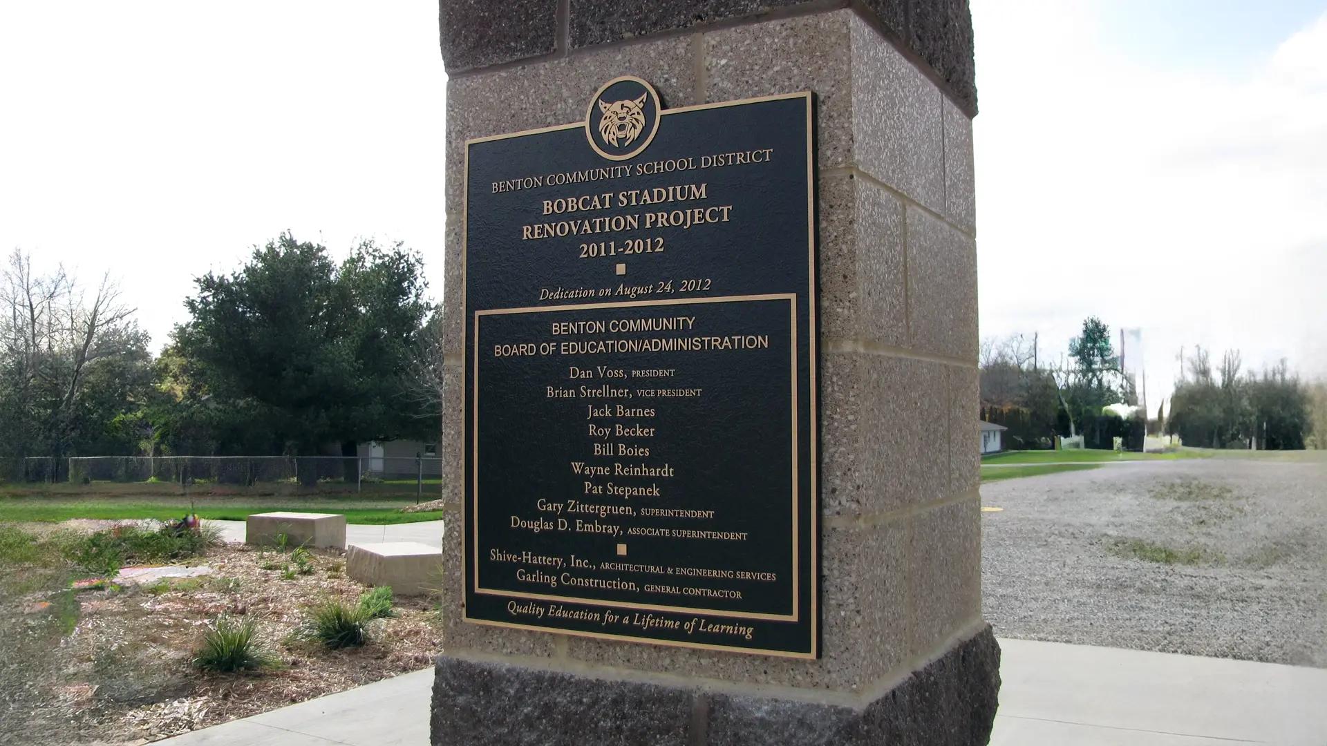 Benton High School outdoor bronze plaque mounted on a stone pillar honoring donors of the Bobcat Stadium renovation.