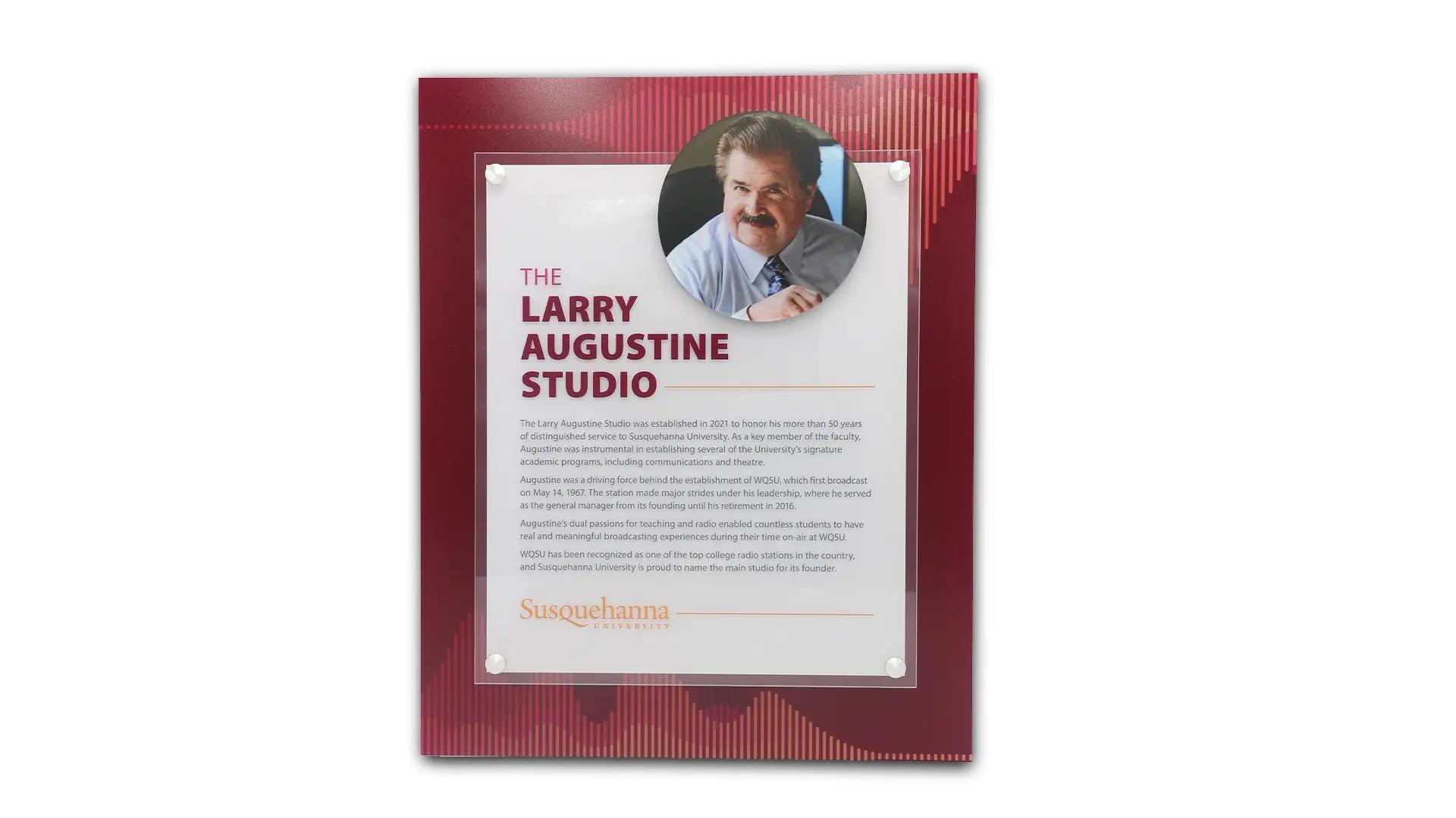 Susquehanna University donor plaque honoring The Larry Augustine Studio with portrait, layered acrylic panels, and printed studio history.
