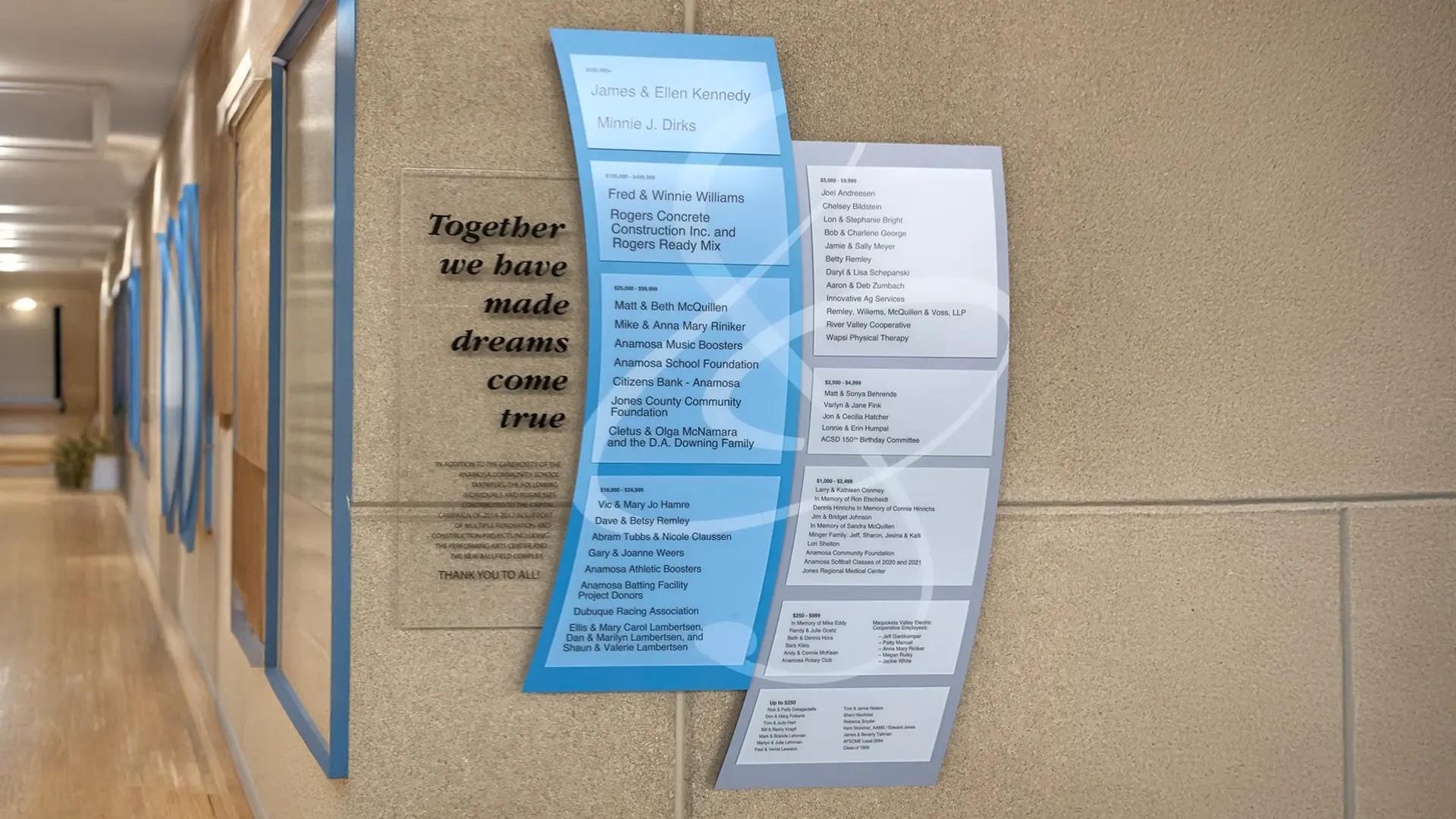 School performing arts building campaign donor recognition wall with layered blue acrylic panels and engraved acrylic message.
