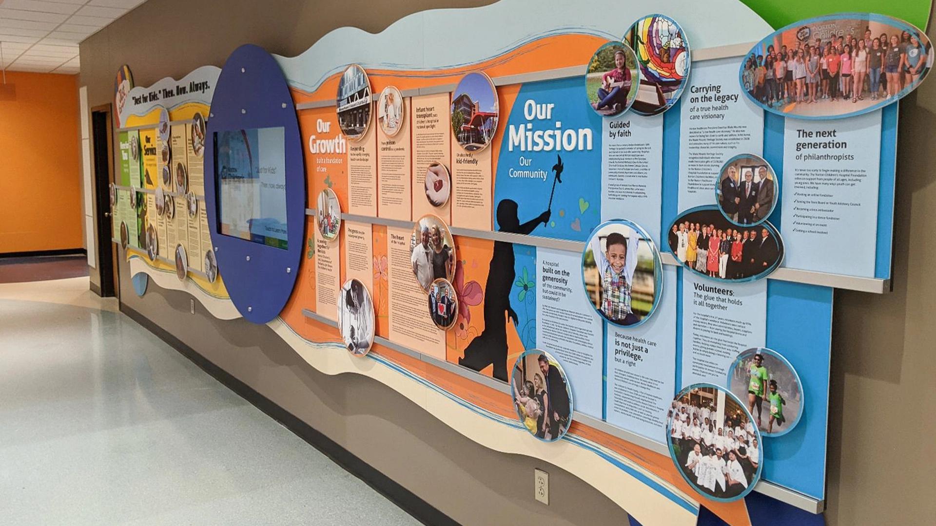Norton Children’s Hospital digital donor wall built with the Rail Wall System with interactive display, mission storytelling, and donor recognition.