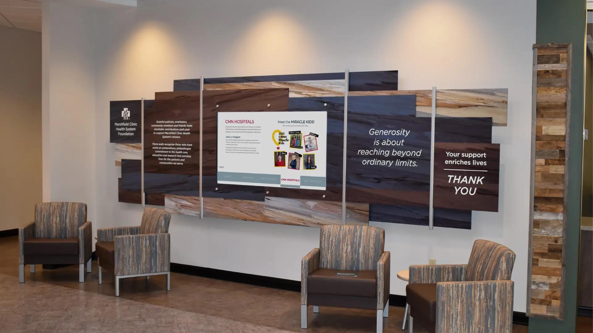 Digital donor wall with layered wood-look panels and an interactive touchscreen powered by Arreya, sharing donor stories in a healthcare lobby.