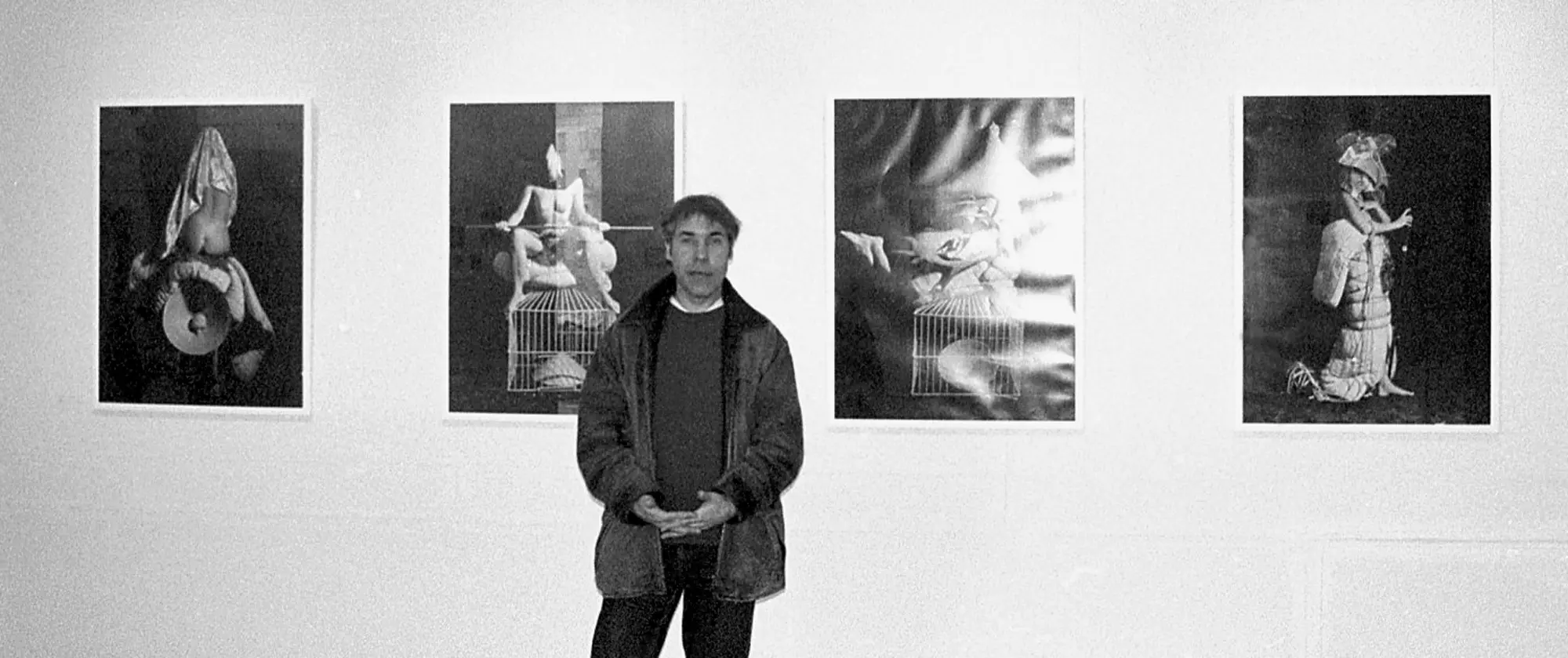Vasily Ryabchenko in front of his artworks at the exhibition "Photosynthesis", Kiev, Ukraine, 1997