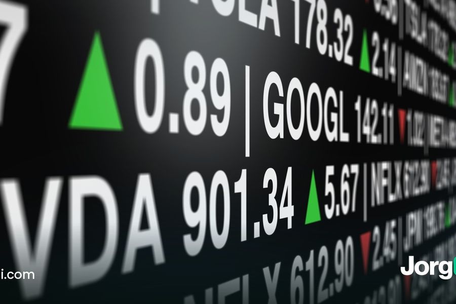 Close-up of a stock ticker board showing NVDA, GOOGL and NFLX prices, cover for the guide to slippage in trading