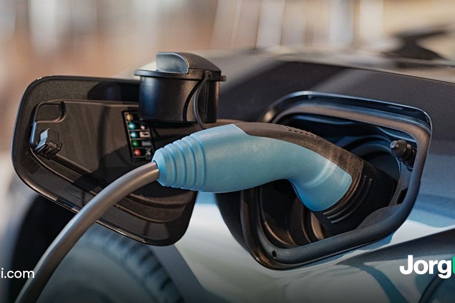 Charging cable plugged into an electric car, cover for the Tesla Q3 2026 results and earnings-reaction study