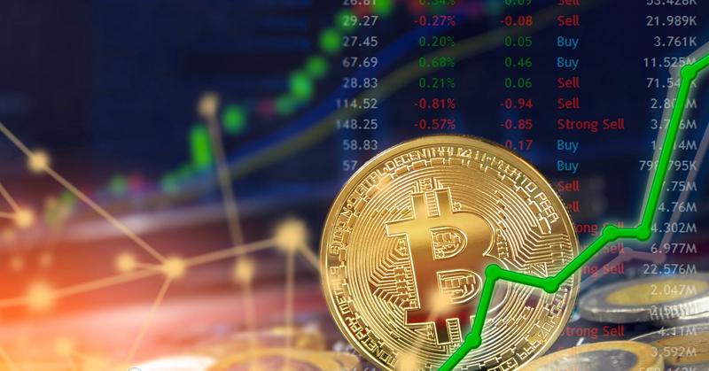 Gold bitcoin coin among other coins in front of a price board with buy and sell ratings and a green line chart