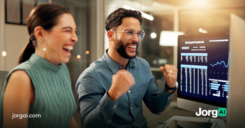 Two people reacting to a screen, cover for the week-ahead earnings preview