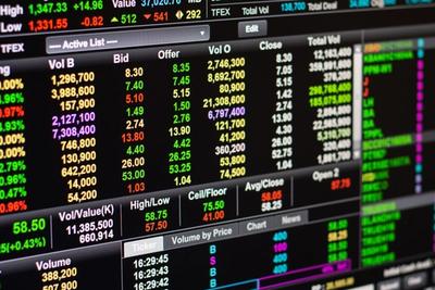 Close-up of a stock quote board with bid, offer and volume figures, representing the PCE inflation number the Fed watches