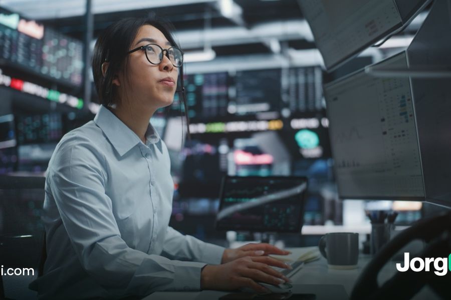 Trader watching falling stock charts on multiple monitors, cover for the October 14, 2026 chip selloff and ASML results post