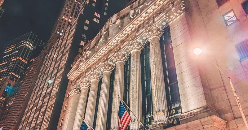 The New York Stock Exchange facade lit up at night ahead of Q3 2026 earnings season