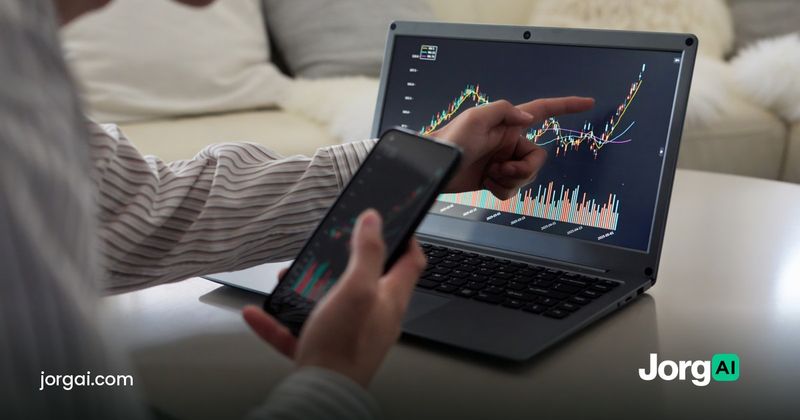 Person checking a stock chart on a laptop and phone at home, cover for the cash account versus margin account guide