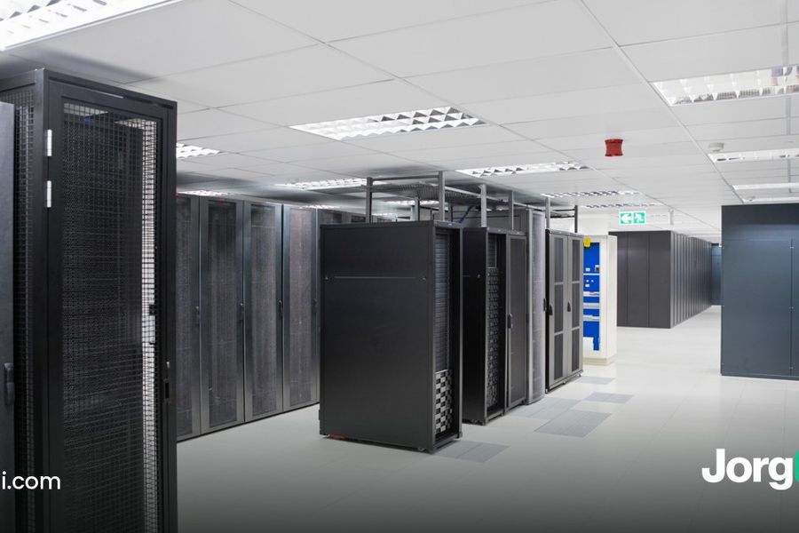 Rows of server racks in an empty data centre, cover for the Microsoft, Alphabet and Amazon earnings week preview