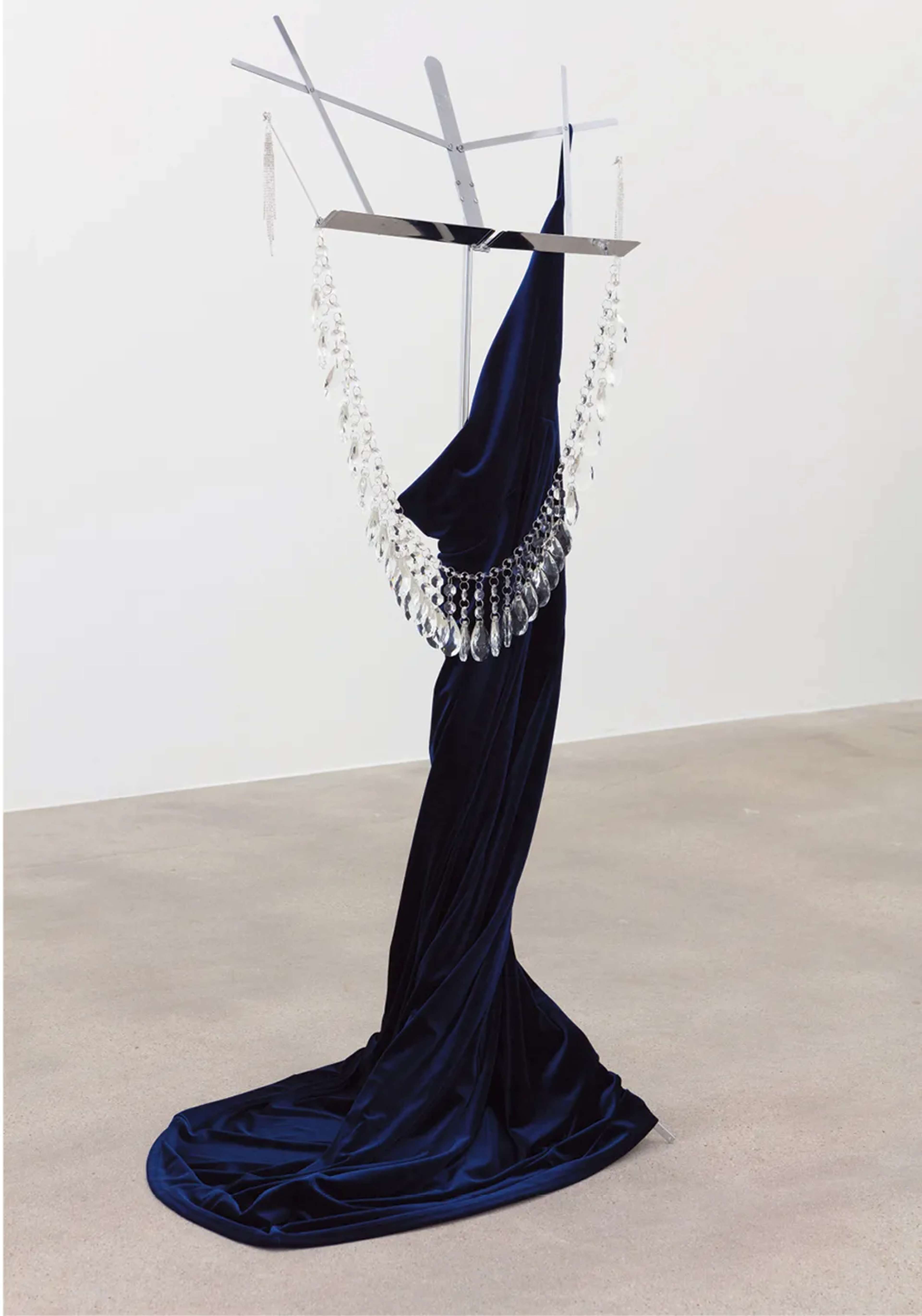 Kayode Ojo, No.5 The Film (São Paulo, Milan, New York, Los Angeles), 2017–19, Sorceress navy-blue velvet maxi dress, Topwholesalejewel bridal long 5-strand silver crystal earrings, 50-mm StarSide crystal chandelier teardrop prisms, crystal-bead lamp chain, Hamilton Stands KB400 classic American folding sheet-music stand (chrome), dimensions variable.