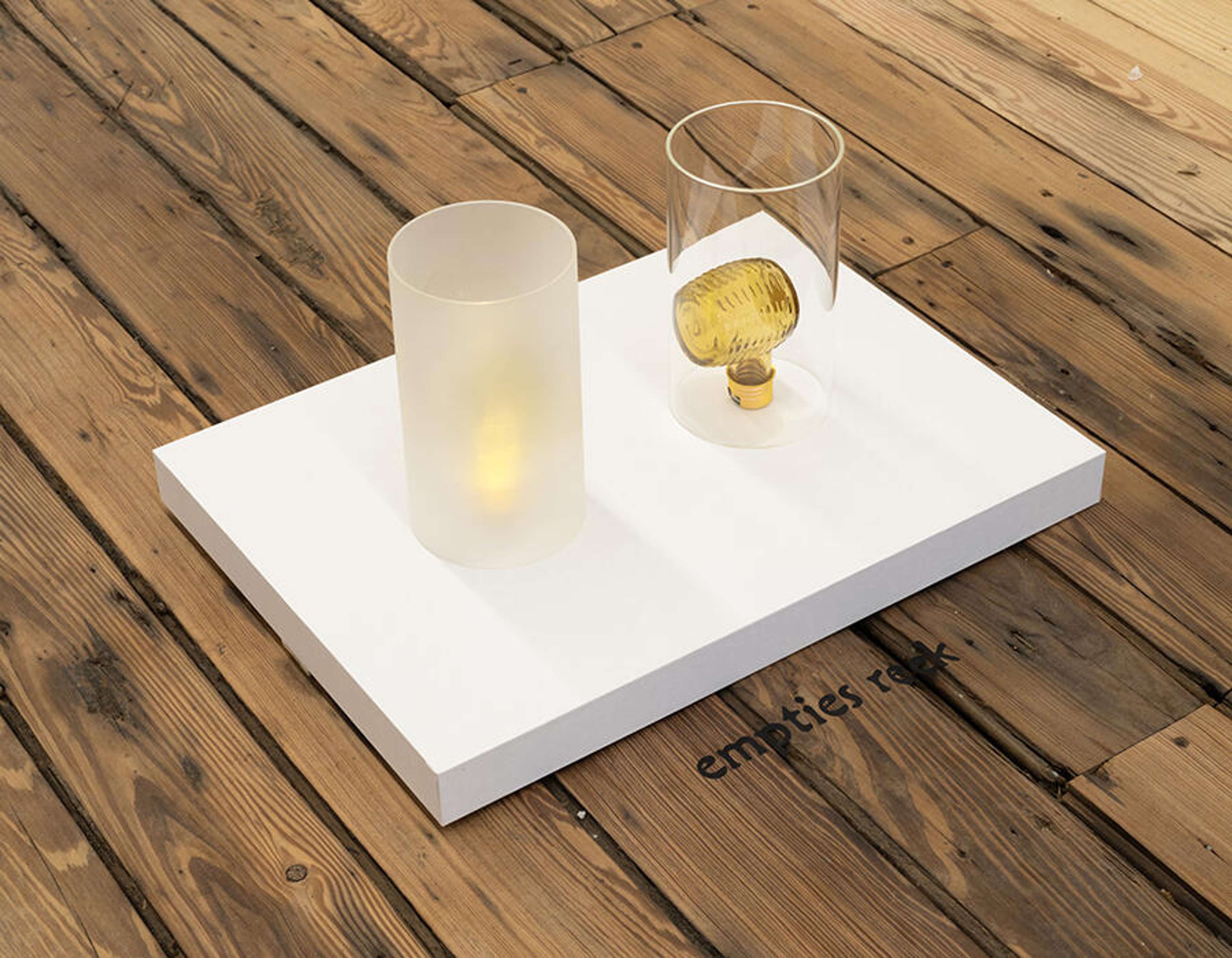 Jesse Stecklow, From Pipe to Light, 2024, Avon Wild Country aftershave, corn cob pipe bottles, glass, electronics, LED lights, paper, MDF, 33 × 45.7 × 24.8 cm. Courtesy: the artist, Dracula's Revenge, New York, and Sweetwater, Berlin; photograph: Jason Mandella