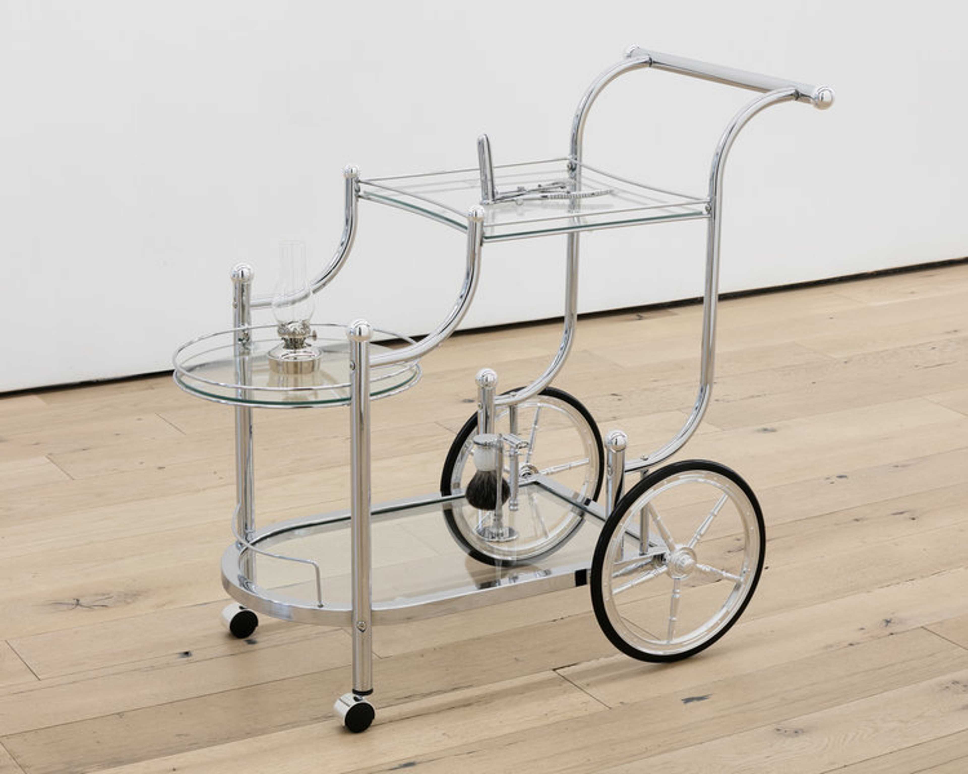 Kayode Ojo: House Call, 2018, Wheeled Serving Cart with Finials Chrome and Clear, Mathieu Rectal Speculum OB/GYN Medical G.S Instruments, Vermont Lanterns Brass Mini XL 7 Small Oil Lamp (Nickel Chrome), and Parker 99R Safety Razor Shave Set with Premium Black Badger Brush, Stainless Steel Stand, and Parker 99R Butterfly Open Safety Razor, 32 by 191/2 by 33 inches; at Martos.