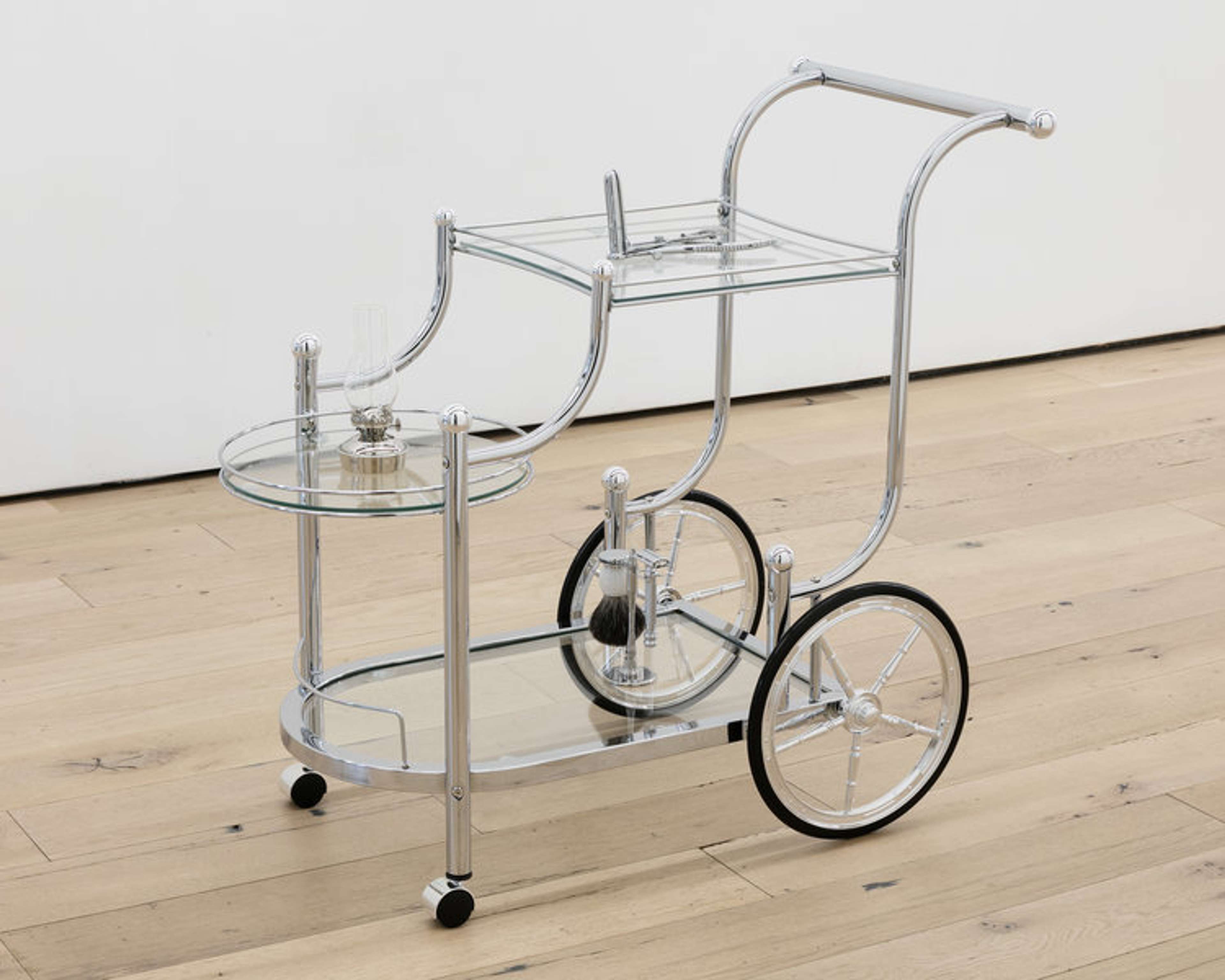 Kayode Ojo: House Call, 2018, Wheeled Serving Cart with Finials Chrome and Clear, Mathieu Rectal Speculum OB/GYN Medical G.S Instruments, Vermont Lanterns Brass Mini XL 7 Small Oil Lamp (Nickel Chrome), and Parker 99R Safety Razor Shave Set with Premium Black Badger Brush, Stainless Steel Stand, and Parker 99R Butterfly Open Safety Razor, 32 by 191/2 by 33 inches; at Martos.